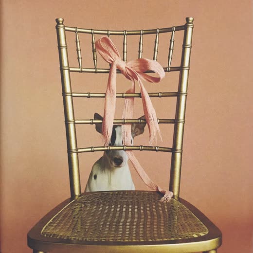 A chiavari chair tied with a hessian bow